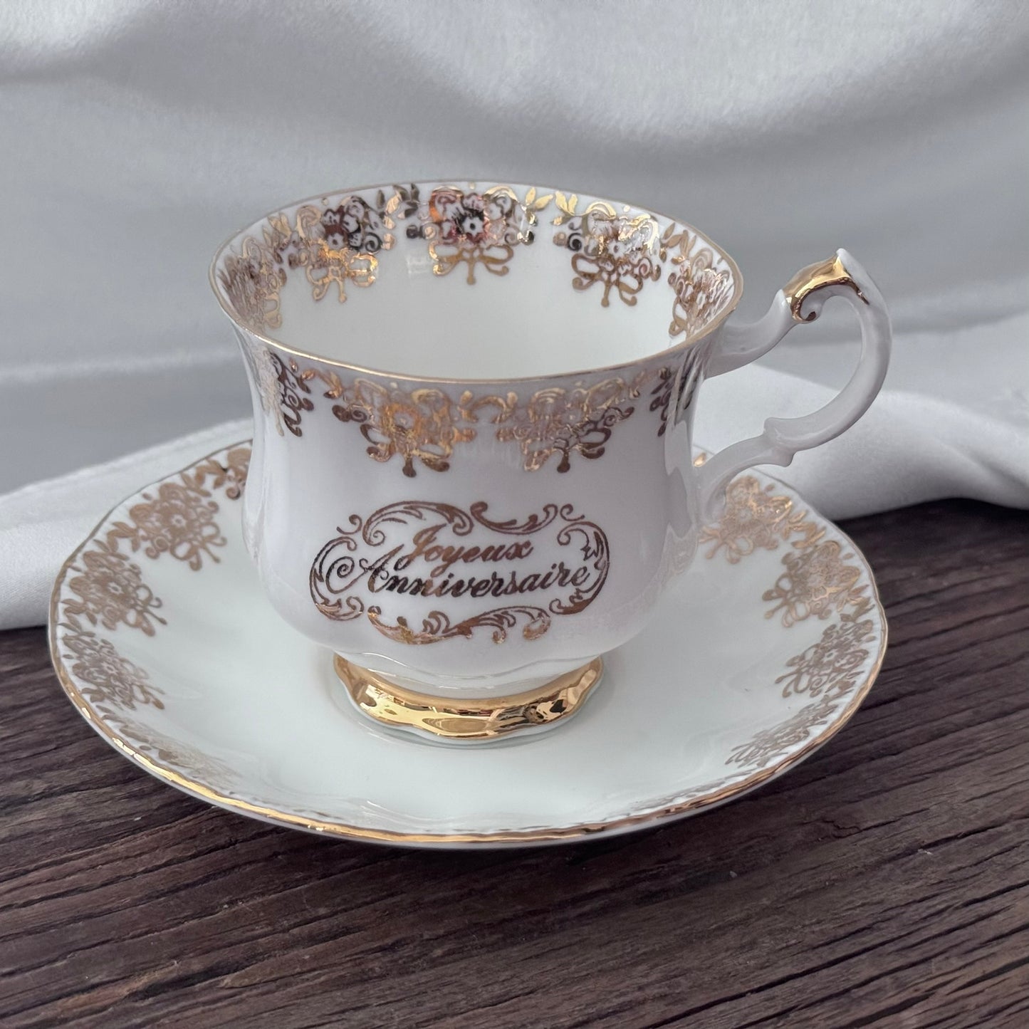 Paragon 'Joyeux Anniversaire' Golden Floral Pattern Teacup and Saucer